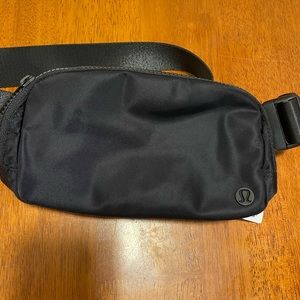 Lululemon Everywhere Belt Bag, NWT, color Black, hold your essentials .